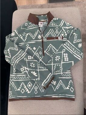 The North Face Men's Green and White Patterned Half-Zip Sweater with Brown Trim